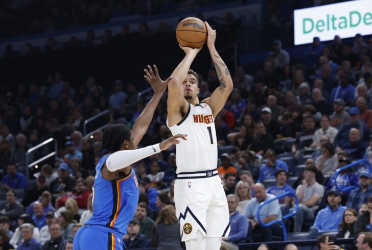 Thunder forward Jalen Williams (8) defends a shot by Denver Nuggets forward Michael Porter Jr. (1) during the second quarter at Paycom Center.