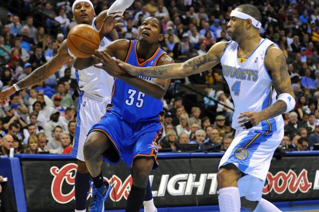 Historical image: Oklahoma City Thunder forward Kevin Durant (35) is fouled by Denver Nuggets forward Kenyon Martin (4) and forward Carmelo Anthony (15) in the second half at the Pepsi Center in 2009. The Nuggets defeated the Thunder 102-93.